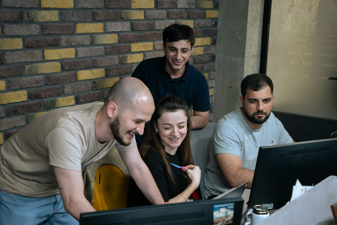 business team discussing code