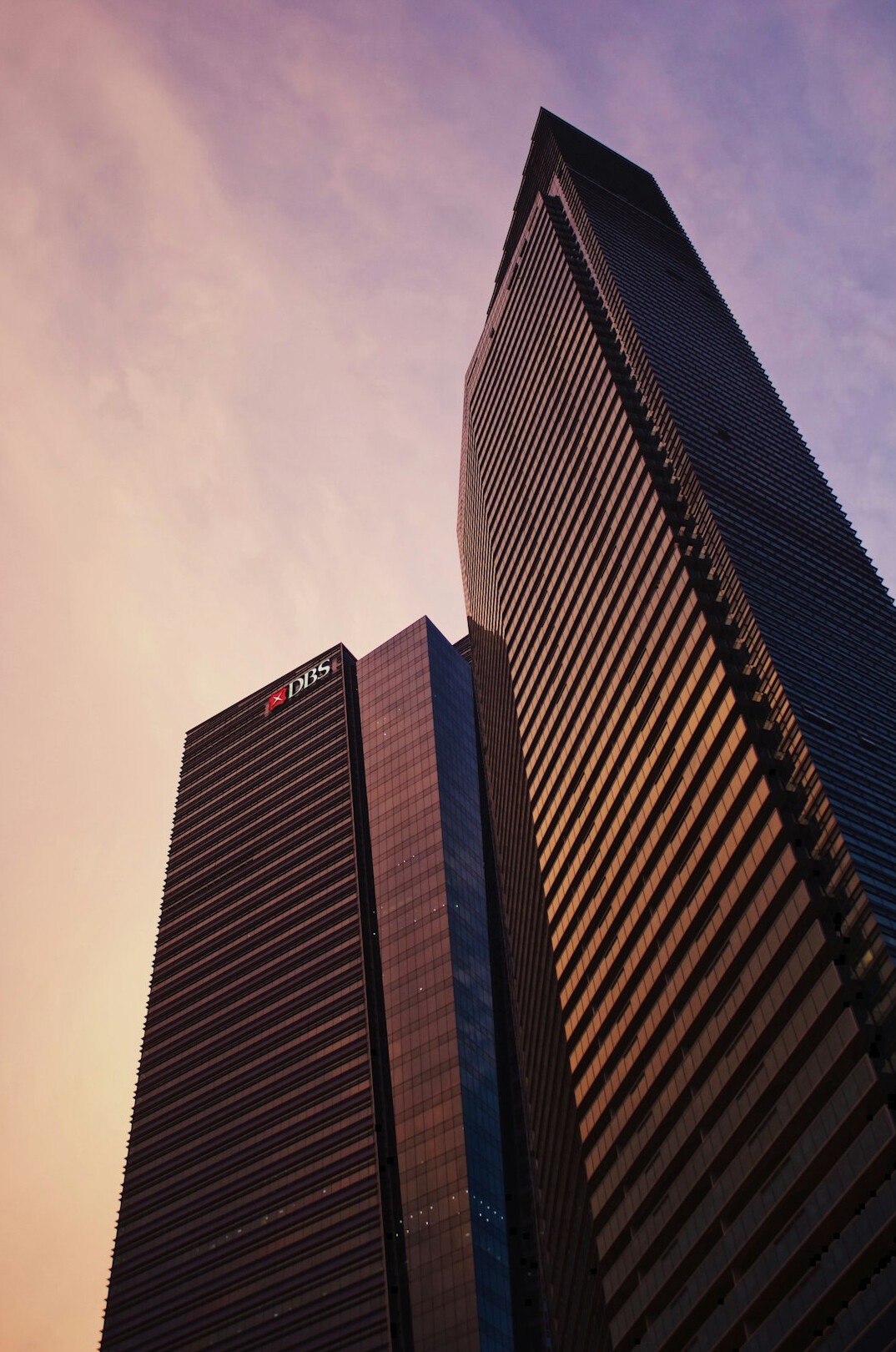 Modern office tower in Singapore's financial district at dusk