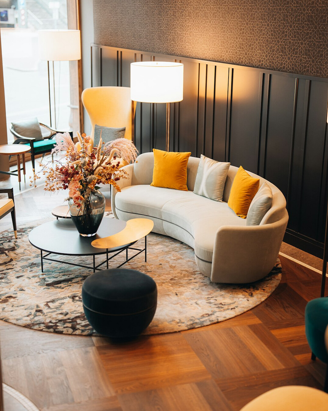 Bright modern office reception area with seating and plants
