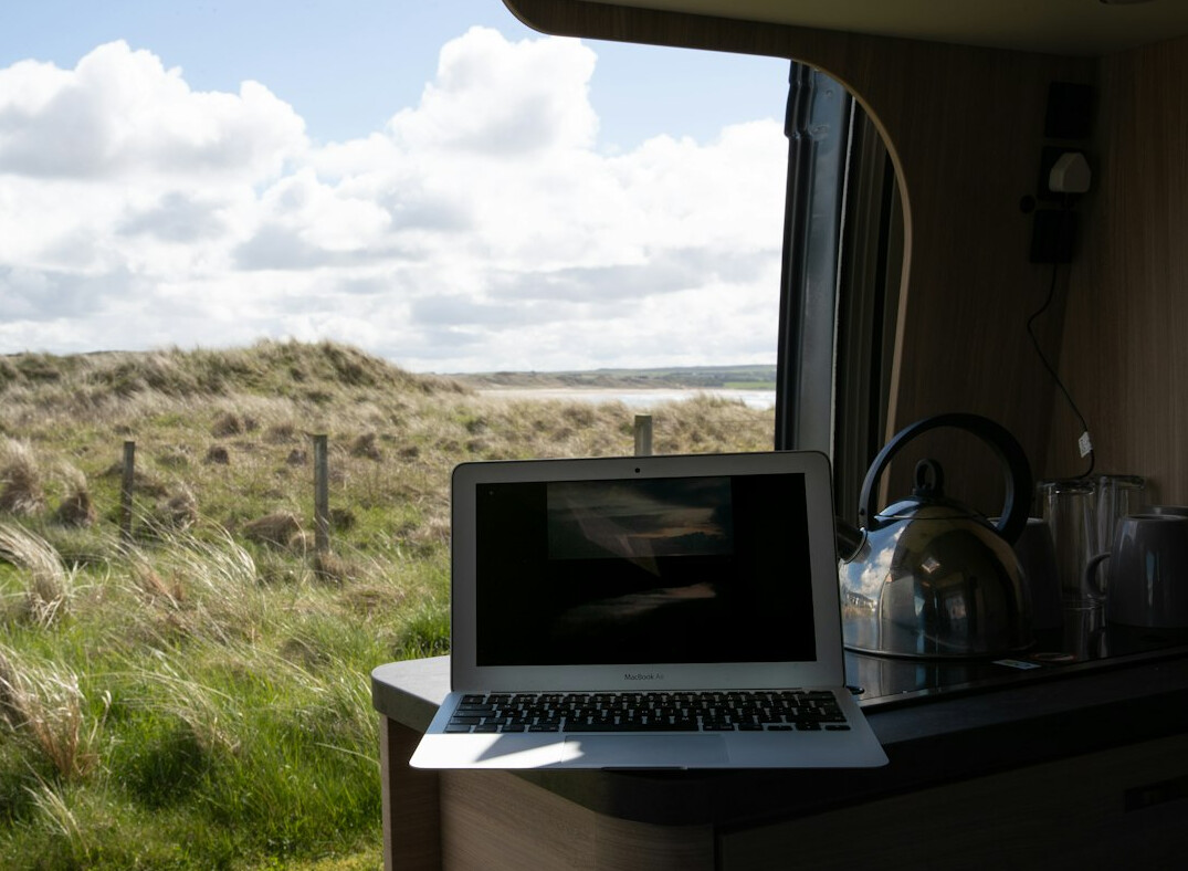 Laptop screen displaying a software analytics dashboard with charts